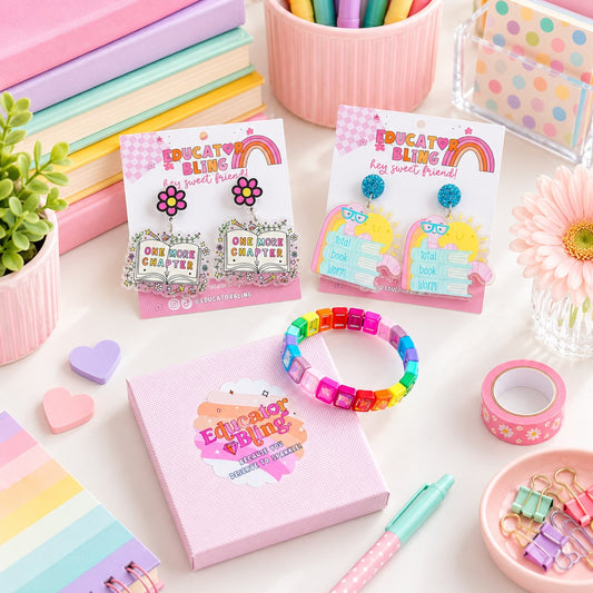 Educator Bling Book Week Teacher Bundle flat lay – Total Book Worm and One More Chapter teacher earrings with the rainbow crystal bracelet and gift box