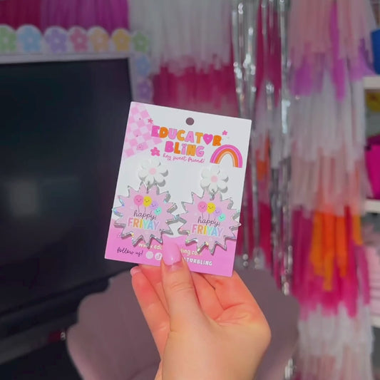 Short video showing Happy FriYAY rainbow glitter acrylic dangle earrings sparkling in the light – handmade teacher accessory by Educator Bling.