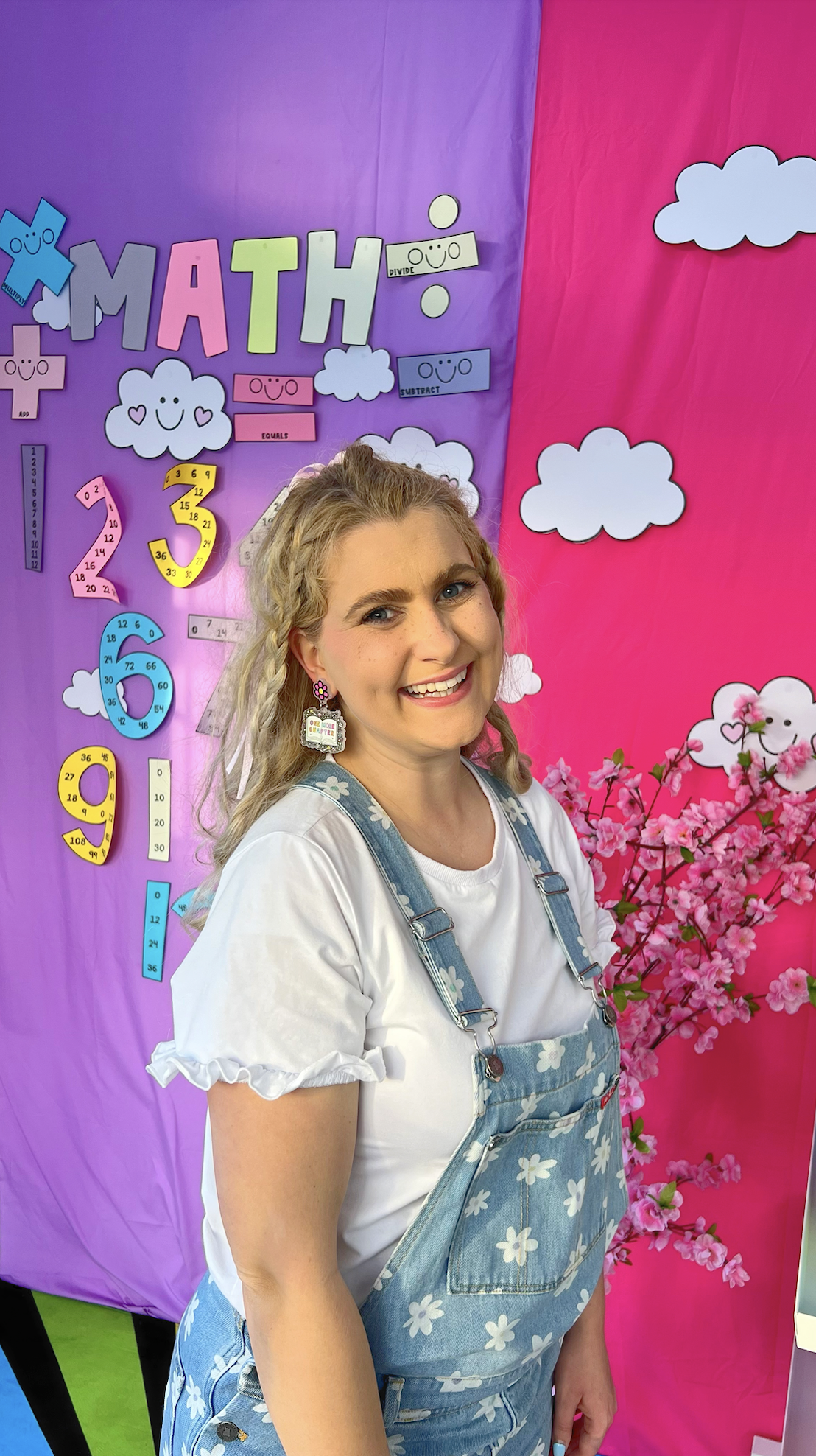One More Chapter book-loving teacher earrings styled with pastel books