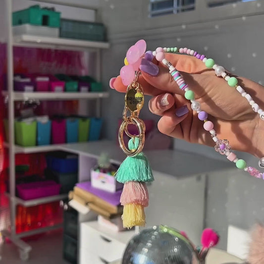 8-second product video showing pastel beaded teacher lanyard sparkling in classroom light