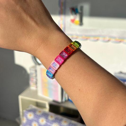 Rainbow crystal tile stretch bracelet worn on a teacher's wrist – Educator Bling